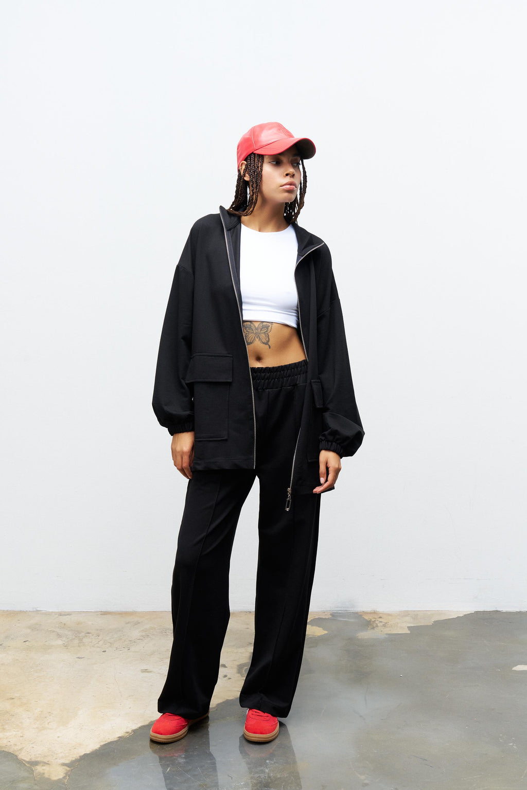 Siyah Kadın Dik Yaka Fermuarlı Kapaklı Cep Detaylı Bol Paça Pamuklu Örme Alt Üst Takım